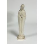 A Hummel pottery blanc de chine figure, Madonna, with hands held in prayer, on square moulded