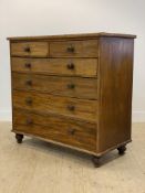A Victorian mahogany chest, fitted with two short and four long graduated drawers, raised on bun