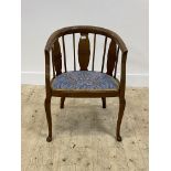 An Edwardian mahogany framed tub chair, with upholstered seat and cabriole supports. H76cm