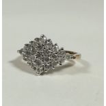 A 9ct gold triangular diamond cluster ring, each stone approx. 0.01ct, mounted in white gold (P/