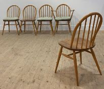 Ercol, a set of six(4+2) hoop and spindle back dining chairs, with saddle seats, raised on
