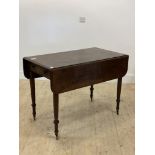 A mid 19th century mahogany Pembroke table, the top with two drop leaves above a drawer opposed by a