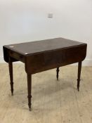 A mid 19th century mahogany Pembroke table, the top with two drop leaves above a drawer opposed by a