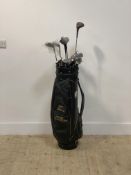A partial set of Dunlop golf clubs, together with eight other golf clubs by various makers (15) in a