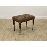 A Victorian rosewood framed stool, the top covered in needlepoint fabric worked in a geometric