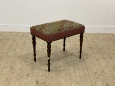 A Victorian rosewood framed stool, the top covered in needlepoint fabric worked in a geometric