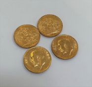 Coins: four gold George V sovereigns, 2 x 1911, 1913 and 1930