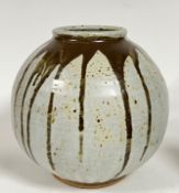 A large Anglo-Oriental Nuka glazed studio pottery vase of globular form with brown ash glaze/iron