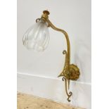 An early 20th century Art Nouveau style cast brass single branch wall sconce complete with