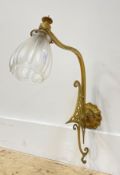 An early 20th century Art Nouveau style cast brass single branch wall sconce complete with