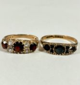A three stone graduated garnet set 9ct gold ring, mounted with cz spacers (O/P) and a 9ct gold two