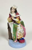 A 19thc Continental porcelain figure, Lady in Courtly Dress, with polychrome and gilt decoration, on