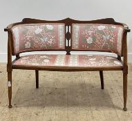 An Edwardian upholstered beech framed drawing room sofa, raised on turned supports. H83cm, W113cm,