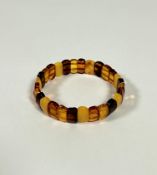 A four coloured oval bead amber adjustable bracelet (each bead: 0.5cm x 1cm) (9.9g)