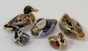 A collection of Royal Crown Derby bone china paperweights comprising a blue resting duck (w-