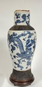 A large Chinese blue and white crackle glaze pottery baluster vase, the foot and shoulder with