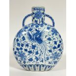 A large Chinese blue and white moon flask depicting phoenix and flowers, with six character