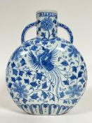 A large Chinese blue and white moon flask depicting phoenix and flowers, with six character