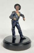 A cold painted bronze figure of a sailor on round wooden base, (h- 17cm)
