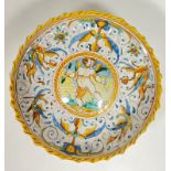 A late 19th century Italian maiolica tin-glazed Istoriato pottery stemmed bowl depicting Cupid in