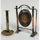 An Edwardian copper arched gong stand complete with oval hammered gong and beater, raised on