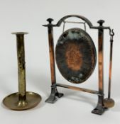 An Edwardian copper arched gong stand complete with oval hammered gong and beater, raised on