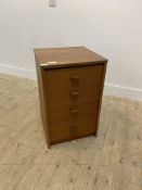 A teak chest fitted with four graduated drawers H69cm, W44cm, D44cm
