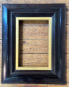 A late 19thc walnut heavy moulded picture frame with gilt slip (internal including slip: 35cm x 22cm