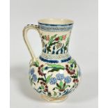 A Zsolnay Pecs Hungarian pottery jug with lotus flower and chrysanthemum decoration enclosed