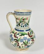 A Zsolnay Pecs Hungarian pottery jug with lotus flower and chrysanthemum decoration enclosed