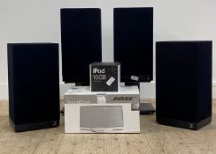 A set of four speakers by KEF, two with stands, together with a bose sound dock in original box, and
