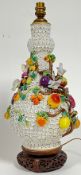 A large Meissen marked Schneeballen vase converted to a lamp base decorated with fruits and birds
