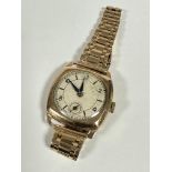 A Swiss 9ct gold mounted gentleman's vintage wristwatch with silvered dial, baton and alternating