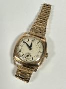A Swiss 9ct gold mounted gentleman's vintage wristwatch with silvered dial, baton and alternating
