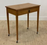 An oak side table, first half of the 20th century, fitted with frieze drawer above square taperer