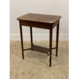 An Edwardian boxwood strung mahogany side table, the cross banded top with canted corners raised