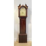 A mahogany longcase clock, first half of the 19th century, the hood with brass finials, swan neck