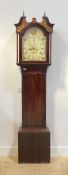 A mahogany longcase clock, first half of the 19th century, the hood with brass finials, swan neck