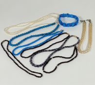 A collection of bead necklaces including two turquoise bead necklaces and panel bracelet, amethyst