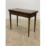 A 19th century mahogany fold over tea table, fitted with frieze drawer, raised on square tapered