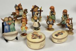 A collection of nine Hummel pottery figures including, Coquettes, What's That, All Smiles, Little