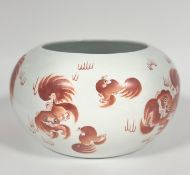 A mid century Chinese porcelain fish bowl of circular enclosed form, decorated with playing