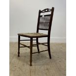 An Edwardian stained beech framed bedroom chair, double 'c' scroll to crest over spindle back,