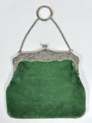 An Edwardian Art Nouveau Birmingham silver mounted green suede bag, with original watered green silk