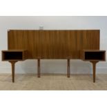 A mid century walnut headboard with integrated bedsides H97cm, W184cm, D37cm