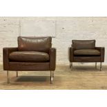 A pair of quality contemporary easy chairs, each upholstered brown leather, raised on square section