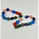 A set of twenty five Murano coloured glass cane faceted beads - partially strung, largest (2cm x