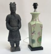 A Terracottta model Chinese warrior, in the period style (chip to base) (h- 46cm) and a ceramic