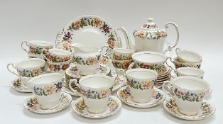 A Paragon China 'Country Lane' part tea/coffee service decorated with floral sprays and gilt