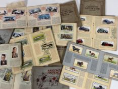 A collection of cigarette picture card albums comprising Motor Cars, Dogs, Sea Fishes, Life in the